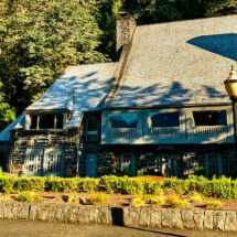 View of the Historic Multnomah Falls Lodge in evening sunlight.